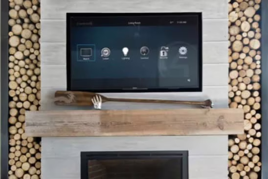 Control4 smart home automation touch screen interface mounted on a luxury accent wall.