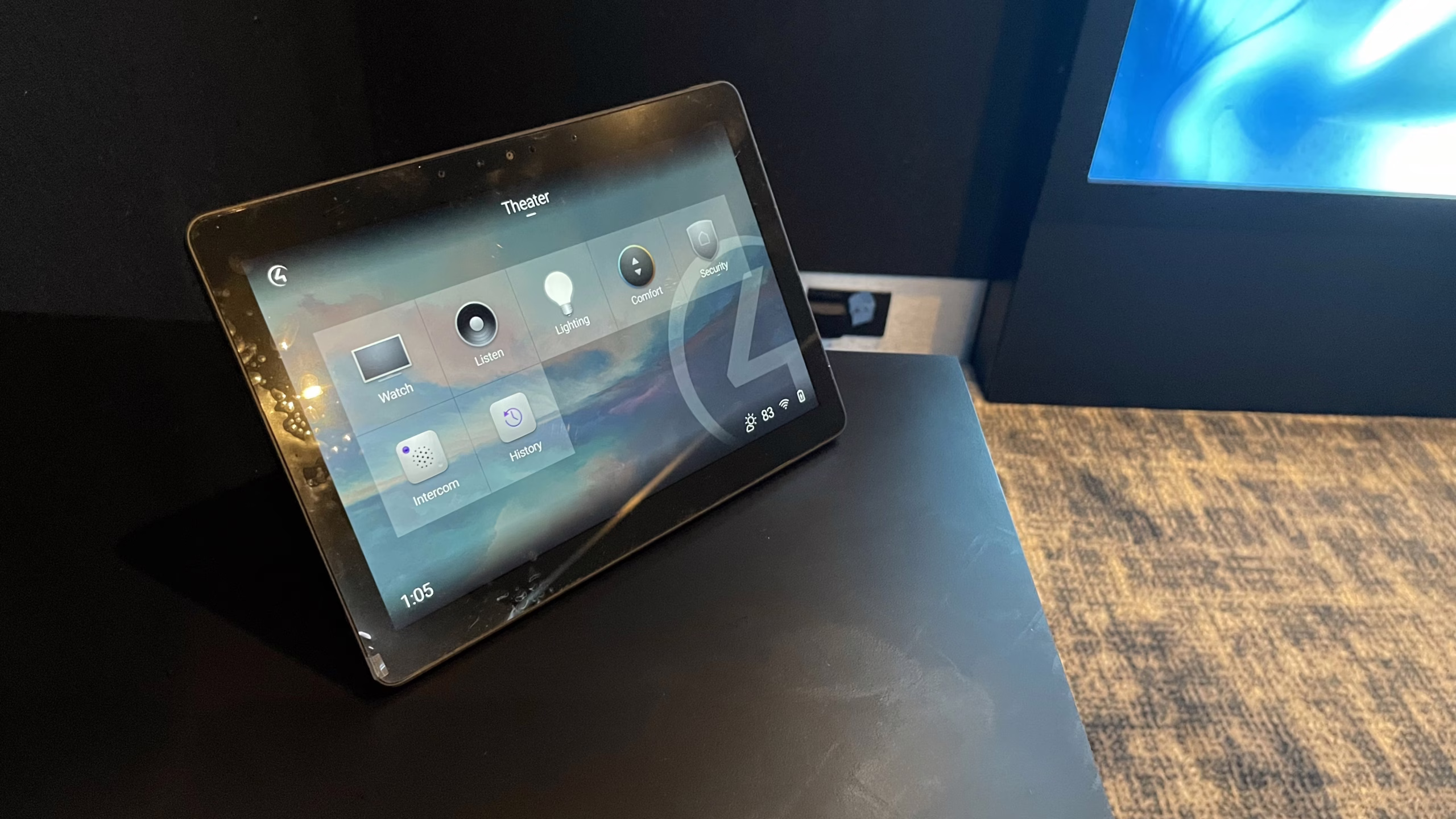 Control4 dedicated touchpanel interface mounted on a sleek countertop for seamless home theater and smart home control in a Palm Beach estate.